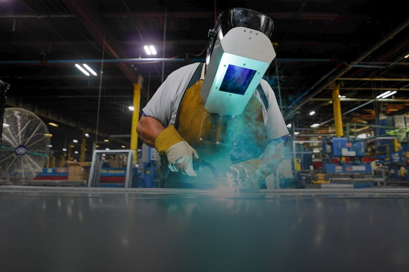Man welding in facility