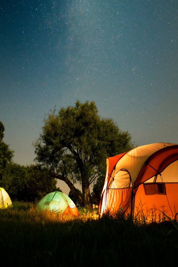 tent in moonlight with stars
